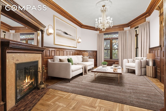 unfurnished room featuring an inviting chandelier, a fireplace, ornamental molding, and wainscoting