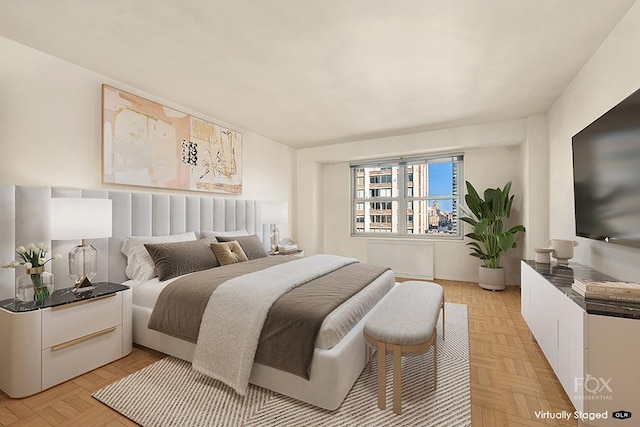 bedroom featuring light parquet flooring