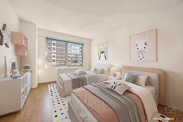 bedroom featuring light parquet floors