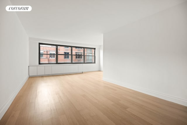 spare room featuring light hardwood / wood-style floors