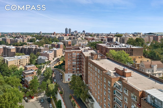 birds eye view of property featuring a city view