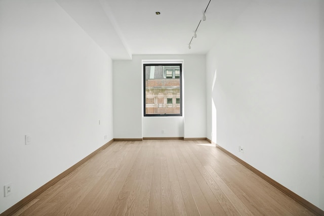 88 Lexington Ave Unit 507, New York City, NY 10016 - spare room with rail lighting and light wood finished floors