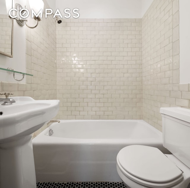 full bathroom featuring tile patterned flooring, shower / bath combination, tile walls, and toilet