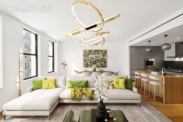 living room with an inviting chandelier and wood finished floors