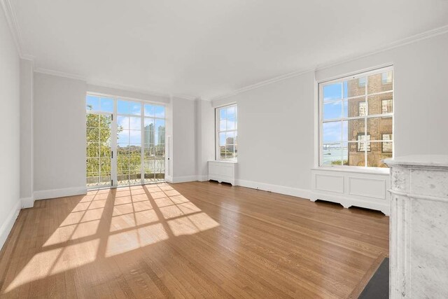 dining space featuring crown molding, dark parquet flooring, and a notable chandelier