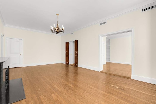 office featuring built in shelves, light wood-type flooring, and crown molding