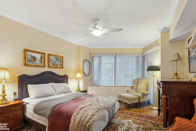 bedroom featuring crown molding and a ceiling fan