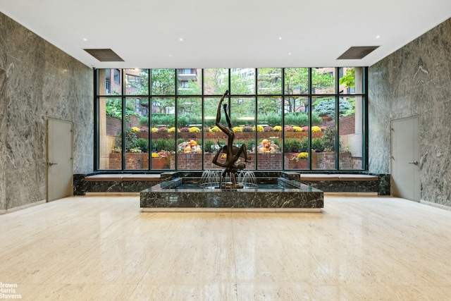 living room with wine cooler, a notable chandelier, parquet floors, and ornamental molding