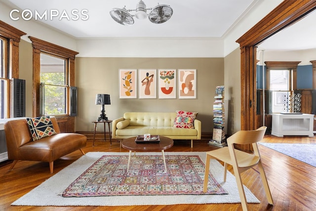 living room with plenty of natural light and wood finished floors