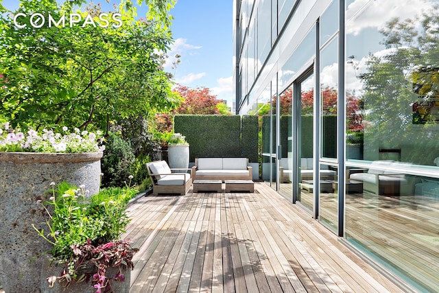 wooden deck featuring an outdoor living space