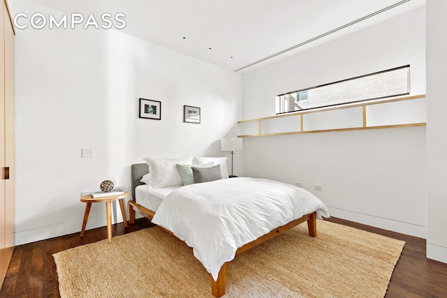 bedroom featuring wood finished floors