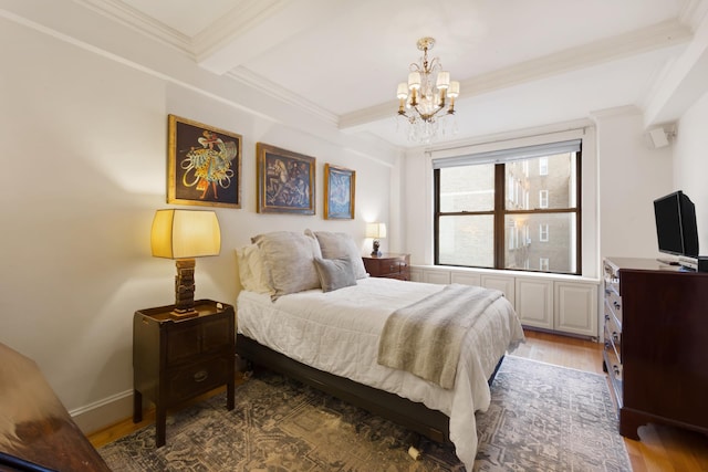 bedroom featuring a chandelier, ornamental molding, wood finished floors, and beamed ceiling