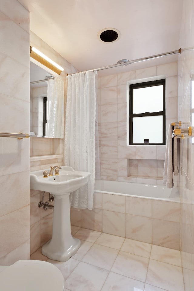12 E 97th St Unit 8E, New York City, NY 10029 - bathroom with tiled shower / bath and tile patterned flooring
