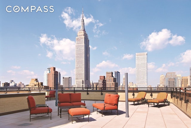 view of patio with a view of city and outdoor lounge area