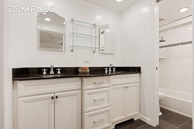 137 E 36th St Unit 2A, New York City, NY 10016 - full bath featuring double vanity, toilet, bathing tub / shower combination, tile patterned flooring, and recessed lighting