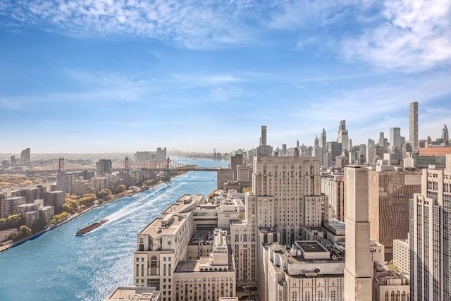 exterior space with a water view and a city view