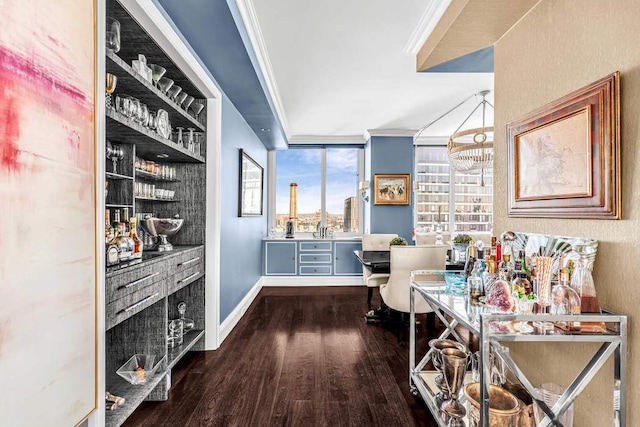 home office featuring baseboards, dark wood-type flooring, and crown molding