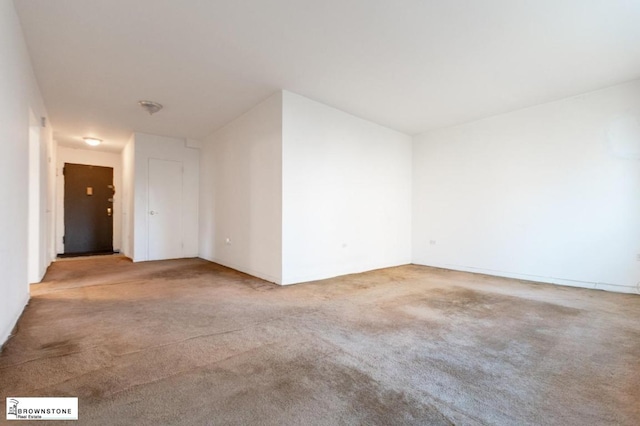 empty room with light colored carpet