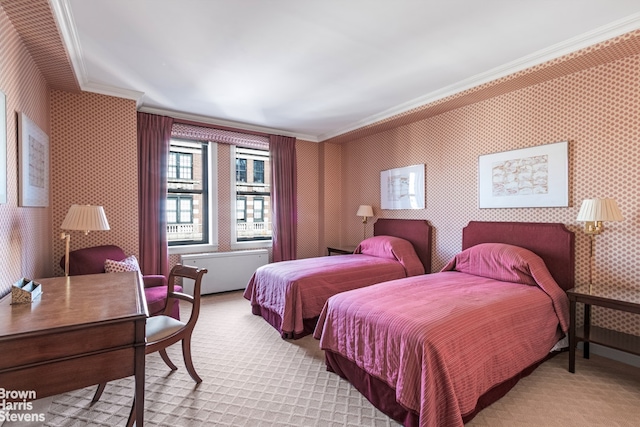 bedroom with crown molding, wallpapered walls, and light carpet