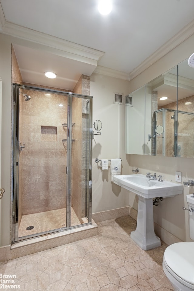 full bathroom with visible vents, a shower stall, toilet, and crown molding