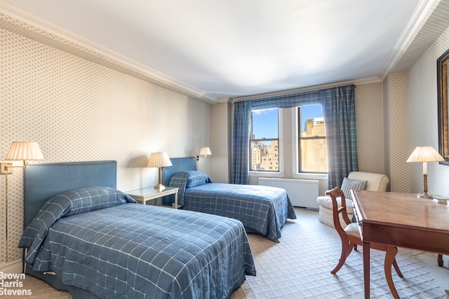 carpeted bedroom featuring crown molding and wallpapered walls