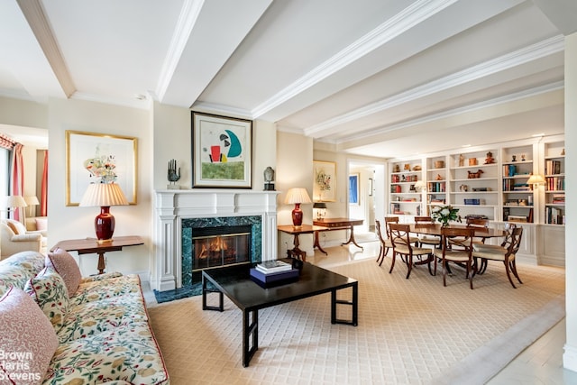 living area with a fireplace, ornamental molding, and beamed ceiling