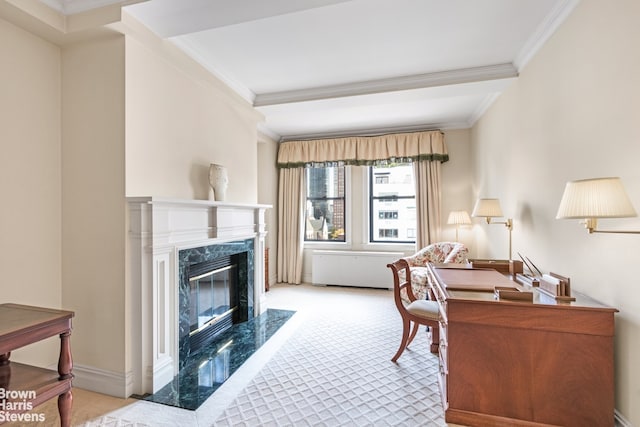 living area featuring a high end fireplace, baseboards, ornamental molding, and radiator