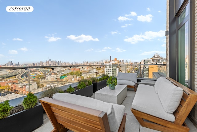 balcony with visible vents, outdoor lounge area, and a city view