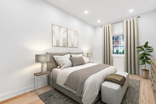 41-15 39th Pl Unit 1, New York City, NY 11104 - bedroom with light wood-style floors, recessed lighting, and baseboards