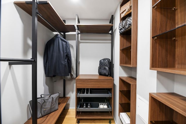 walk in closet featuring light wood-type flooring