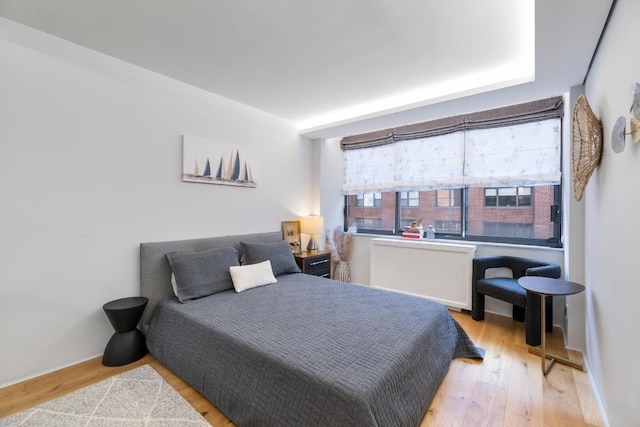 bedroom with light hardwood / wood-style flooring