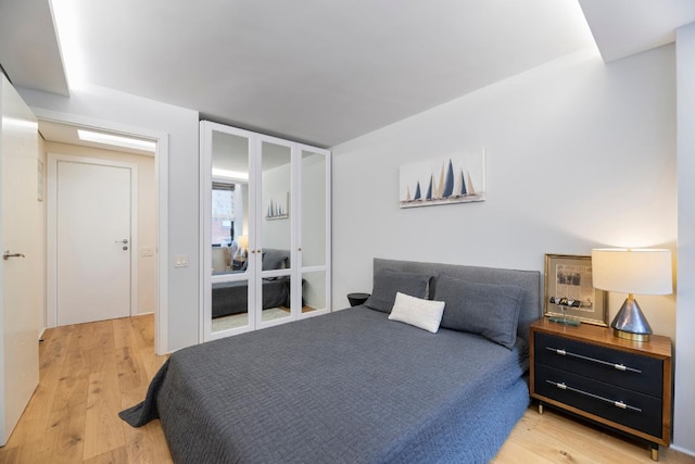 bedroom with light hardwood / wood-style flooring