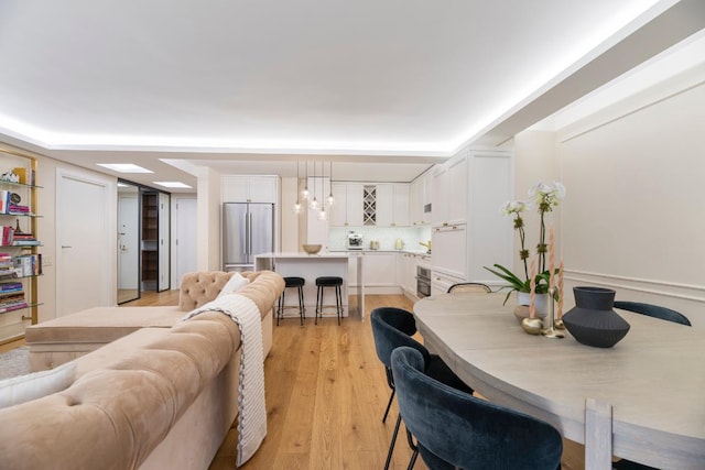 dining room with light hardwood / wood-style floors