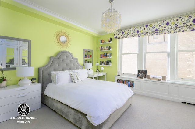 carpeted bedroom with ornamental molding and a chandelier