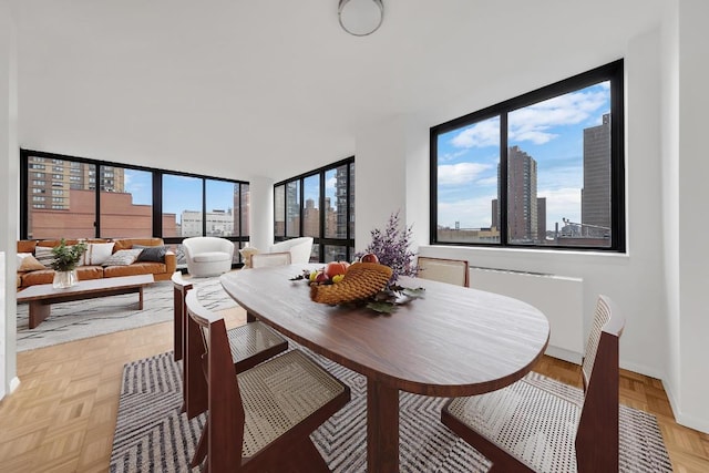 dining room with light parquet floors