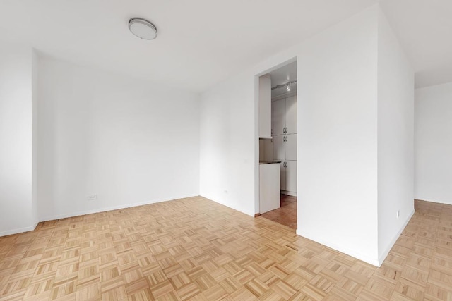 unfurnished room with light parquet floors