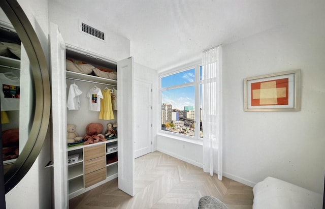 mudroom with light parquet flooring