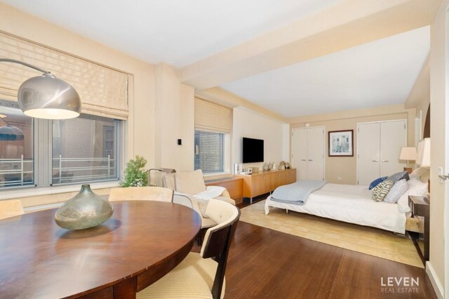 living room with hardwood / wood-style flooring and sink