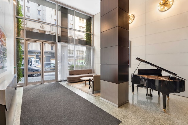 100 W 58th St Unit 11Ab, New York City, NY 10019 - lobby featuring expansive windows and a towering ceiling