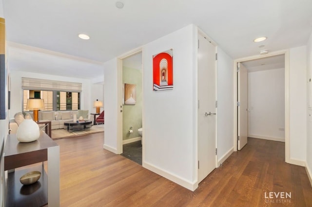 hall with hardwood / wood-style floors