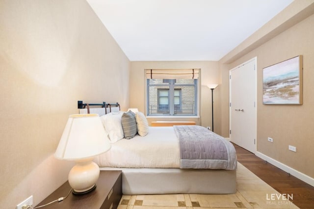 bedroom featuring hardwood / wood-style floors