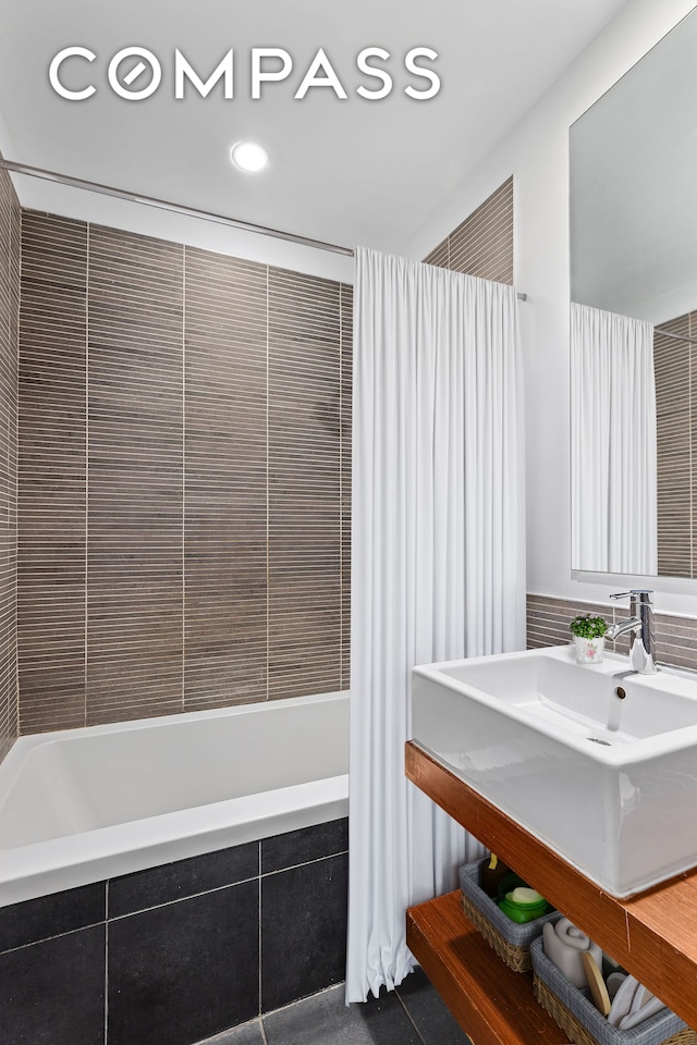242 S 1st St Unit 4E, New York City, NY 11211 - bathroom with tiled shower / bath, recessed lighting, tile patterned floors, and vanity