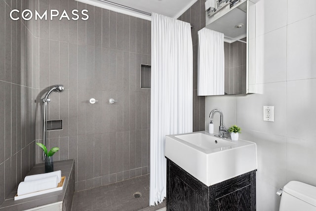 242 S 1st St Unit 4E, New York City, NY 11211 - full bathroom with a tile shower, toilet, and vanity