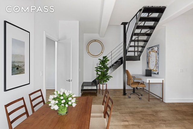 office area featuring baseboards and wood finished floors