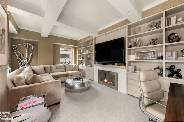 carpeted living area featuring built in shelves, beam ceiling, crown molding, a glass covered fireplace, and coffered ceiling