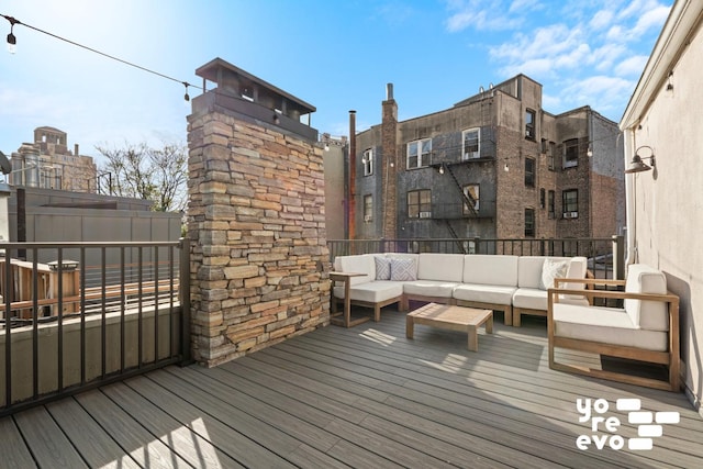 wooden deck featuring outdoor lounge area