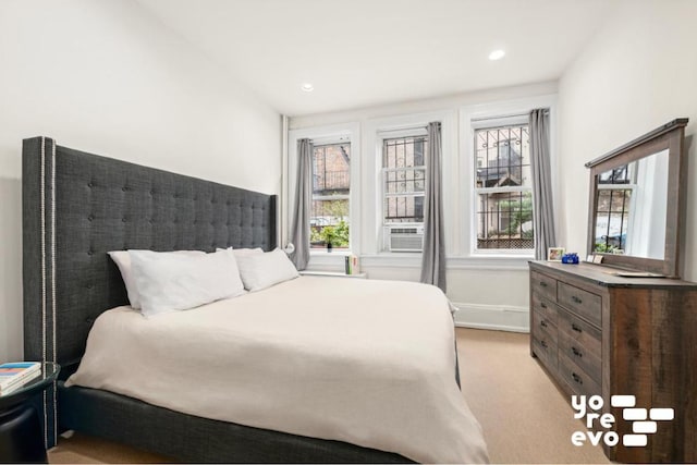 bedroom featuring baseboards, recessed lighting, and light colored carpet