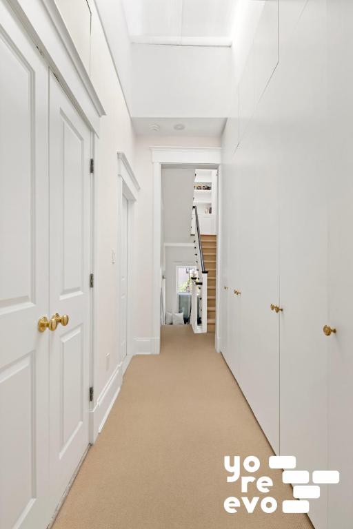 hallway with light carpet