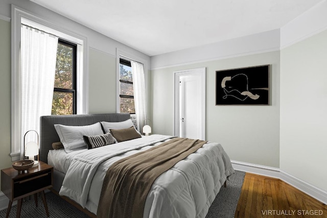 bedroom with wood-type flooring