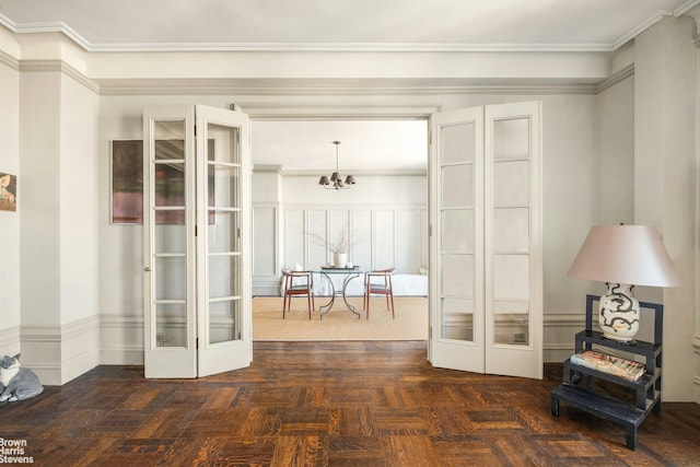 interior space featuring french doors and a notable chandelier